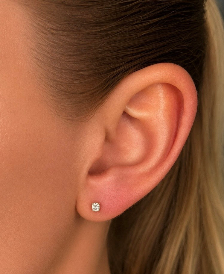 Oval Diamond Earrings worn on ear